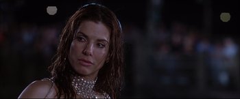 Movie still from “Miss Congeniality 2: Armed & Fabulous” (2005), directed by John Pasquin – A person with wet hair; Close Up shot, Over the shoulder angle