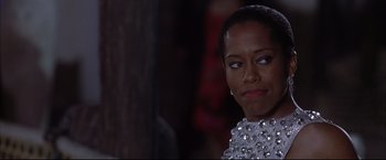 Movie still from “Miss Congeniality 2: Armed & Fabulous” (2005), directed by John Pasquin – A person wearing a dress; Close Up shot, Over the shoulder angle