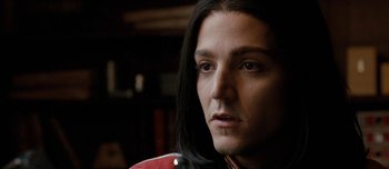 Movie still from “Mister Lonely” (2007), directed by Harmony Korine – A person with long black hair; Close Up shot, Over the shoulder angle