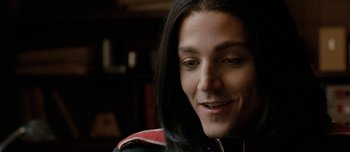 Movie still from “Mister Lonely” (2007), directed by Harmony Korine – A person with long black hair; Close Up shot, Over the shoulder angle