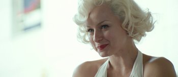 Movie still from “Mister Lonely” (2007), directed by Harmony Korine – A person with blonde hair; Close Up shot, Over the shoulder angle