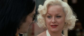 Movie still from “Mister Lonely” (2007), directed by Harmony Korine – A man and a woman are talking to each other; Close Up shot, Over the shoulder angle