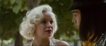 Movie still from “Mister Lonely” (2007), directed by Harmony Korine – A man and a woman talking to each other; Close Up shot, Over the shoulder angle