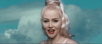 Movie still from “Mister Lonely” (2007), directed by Harmony Korine – A person wearing a white wig; Close Up shot, Low angle