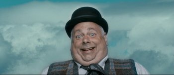 Movie still from “Mister Lonely” (2007), directed by Harmony Korine – A person wearing a suit and a bowler hat; Close Up shot, Low angle