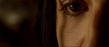 Movie still from “Mister Lonely” (2007), directed by Harmony Korine – View of a woman's eye and brows; Extreme Close Up shot, Overhead angle