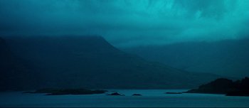 Movie still from “Mister Lonely” (2007), directed by Harmony Korine – A body of water with a mountain in the background; Extreme Wide shot, Low angle