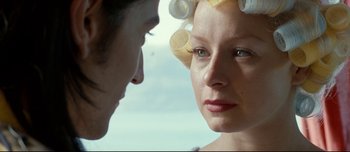 Movie still from “Mister Lonely” (2007), directed by Harmony Korine – A man and a woman with curlers in their hair; Close Up shot, Over the shoulder angle