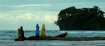 Movie still from “Mister Lonely” (2007), directed by Harmony Korine – A couple of people that are standing in the water; Extreme Wide shot, Low angle