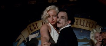 Movie still from “Mister Lonely” (2007), directed by Harmony Korine – A man and a woman dressed up as marilyn monroe and charlie chaplin; Medium shot, Low angle