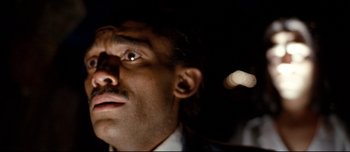 Movie still from “Mister Lonely” (2007), directed by Harmony Korine – A person with a mustache; Extreme Close Up shot, Low angle