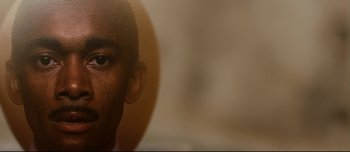 Movie still from “Mister Lonely” (2007), directed by Harmony Korine – A man's face in a mirror; Extreme Close Up shot, Low angle