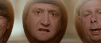 Movie still from “Mister Lonely” (2007), directed by Harmony Korine – A man's face with a hat on; Extreme Close Up shot, High angle