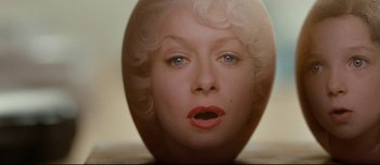 Movie still from “Mister Lonely” (2007), directed by Harmony Korine – The face of a woman with blonde hair; Extreme Close Up shot, Overhead angle