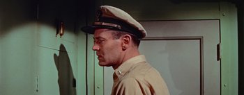 Movie still from “Mister Roberts” (1955), directed by John Ford – A person wearing a hat; Close Up shot, Low angle