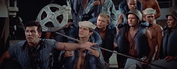 Movie still from “Mister Roberts” (1955), directed by John Ford – A group of men on a boat in the water; Medium shot, High angle