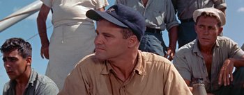 Movie still from “Mister Roberts” (1955), directed by John Ford – A person wearing a hat; Close Up shot, Low angle