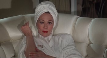 Movie still from “Mommie Dearest” (1981), directed by Frank Perry – A woman with a towel wrapped around her head; Close Up shot, Low angle