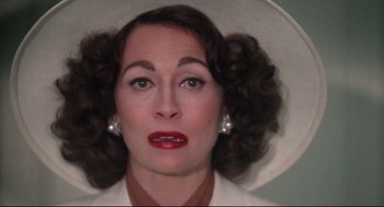 Movie still from “Mommie Dearest” (1981), directed by Frank Perry – A person wearing a hat; Close Up shot, Overhead angle