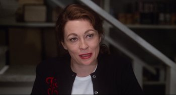 Movie still from “Mommie Dearest” (1981), directed by Frank Perry – A person wearing a jacket; Close Up shot, Over the shoulder angle