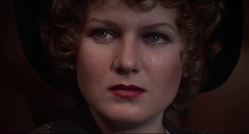 Movie still from “Mommie Dearest” (1981), directed by Frank Perry – A woman's face with tears in her eyes; Close Up shot, Low angle