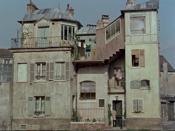 Movie still from “My Uncle” (1958), directed by Jacques Tati – An old building with many windows and balconies on it; Extreme Wide shot, High angle