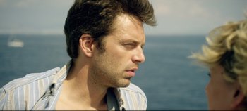 Movie still from “Monday” (2020), directed by Argyris Papadimitropoulos – A person looking at the ocean; Close Up shot, Over the shoulder angle
