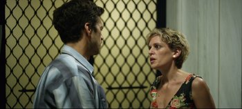 Movie still from “Monday” (2020), directed by Argyris Papadimitropoulos – A man and a woman talking to each other; Close Up shot, Over the shoulder angle