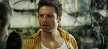 Movie still from “Monday” (2020), directed by Argyris Papadimitropoulos – A person wearing a yellow shirt; Close Up shot, Over the shoulder angle