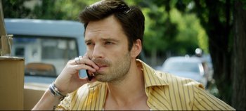 Movie still from “Monday” (2020), directed by Argyris Papadimitropoulos – A person talking on a cell phone; Close Up shot, Low angle