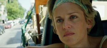 Movie still from “Monday” (2020), directed by Argyris Papadimitropoulos – A person wearing a head band; Close Up shot, Low angle