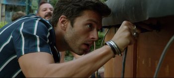 Movie still from “Monday” (2020), directed by Argyris Papadimitropoulos – A person looking at something on the wall; Close Up shot, Low angle