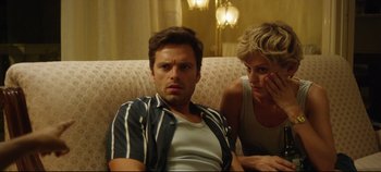 Movie still from “Monday” (2020), directed by Argyris Papadimitropoulos – A man and a woman sitting on a couch; Close Up shot, Over the shoulder angle