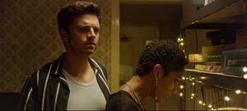 Movie still from “Monday” (2020), directed by Argyris Papadimitropoulos – A man and a woman standing next to each other in front of a mirror; Medium shot, Over the shoulder angle