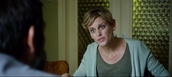 Movie still from “Monday” (2020), directed by Argyris Papadimitropoulos – A person sitting at a table; Close Up shot, Over the shoulder angle