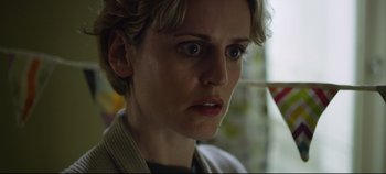 Movie still from “Monday” (2020), directed by Argyris Papadimitropoulos – A person with short blonde hair; Close Up shot, Low angle