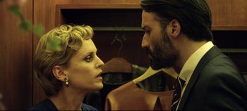 Movie still from “Monday” (2020), directed by Argyris Papadimitropoulos – A man and a woman looking into each others eyes; Close Up shot, Low angle