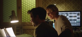 Movie still from “Monday” (2020), directed by Argyris Papadimitropoulos – A man and a woman are smiling at the camera; Medium shot, Low angle