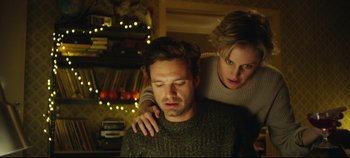 Movie still from “Monday” (2020), directed by Argyris Papadimitropoulos – A man and a woman are hugging in a room; Medium shot, Low angle