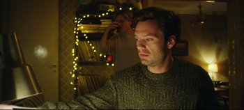 Movie still from “Monday” (2020), directed by Argyris Papadimitropoulos – A man and a woman in front of a christmas tree; Medium shot, Over the shoulder angle