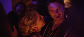 Movie still from “Monday” (2020), directed by Argyris Papadimitropoulos – A man and a woman are kissing in a dark room; Close Up shot, Over the shoulder angle