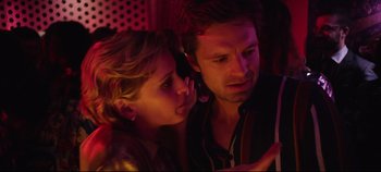 Movie still from “Monday” (2020), directed by Argyris Papadimitropoulos – A man and a woman looking at a cell phone; Close Up shot, Low angle