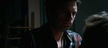 Movie still from “Monday” (2020), directed by Argyris Papadimitropoulos – A person wearing a striped shirt; Close Up shot, Low angle