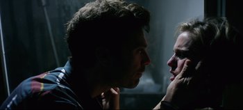 Movie still from “Monday” (2020), directed by Argyris Papadimitropoulos – A man and a woman looking at one another; Close Up shot, Over the shoulder angle