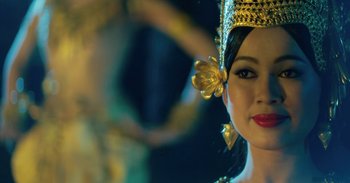 Movie still from “First They Killed My Father” (2017), directed by Angelina Jolie – A person wearing a crown; Close Up shot, Over the shoulder angle