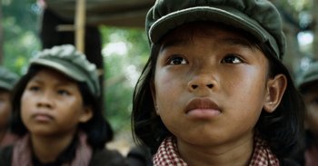 Movie still from “First They Killed My Father” (2017), directed by Angelina Jolie – A child wearing a hat; Close Up shot, Low angle