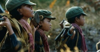 Movie still from “First They Killed My Father” (2017), directed by Angelina Jolie – A group of young boys in a field; Close Up shot, High angle