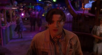Movie still from “Monkeybone” (2001), directed by Henry Selick – A young man in a tan jacket is looking at the camera; Medium shot, Low angle