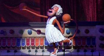 Movie still from “Monkeybone” (2001), directed by Henry Selick – An animated character in a white dress holding an orange ball; Medium shot, Low angle