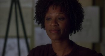 Movie still from “Monkeybone” (2001), directed by Henry Selick – A person wearing a brown t - shirt; Close Up shot, Low angle